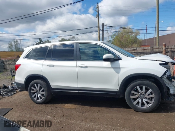 2021 Honda Pilot EX-L with VIN 5FNYF6H57MB054147, listed as a IAAI auction lot 42158910 with 37,811 mi miles and . Bid and sale history available at DreamBid. Image 14.