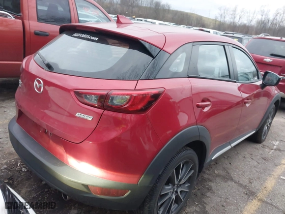 2018 Mazda CX-3 Grand Touring with VIN JM1DKFD75J0305565, listed as a IAAI auction lot 41135957 with 26,810 mi miles. Bid and sale history available at carsss.com. Image 4.