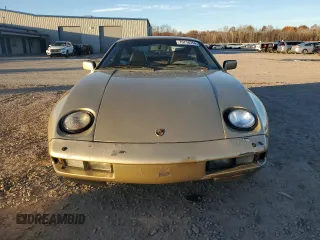 1984 Porsche 928 z VIN WP0JB092XES862382, wystawiony jako Copart lot #79716354 z przebiegiem 117 599 mil mil oraz Szkody całkowita. Historia ofert i sprzedaży dostępna na DreamBid. Obrazek 5.