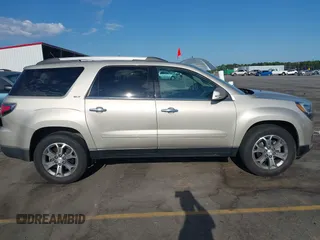 2014 GMC Acadia SLT z VIN 1GKKRSKDXEJ300483, wystawiony jako IAAI lot #42333981 z przebiegiem 167 155 mil mil oraz . Historia ofert i sprzedaży dostępna na DreamBid. Obrazek 13.