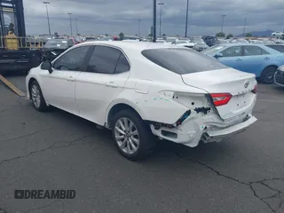 2020 Toyota Camry LE with VIN 4T1C11AK3LU882824, listed as a IAAI auction lot 41765544 with 48,209 mi miles and . Bid and sale history available at carsss.com. Image 3.