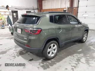 2021 Jeep Compass Latitude with VIN 3C4NJDBB1MT566220, listed as a IAAI auction lot 41816107 with 69,139 mi miles and . Bid and sale history available at DreamBid. Image 4.