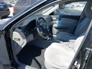 2008 Kia Optima LX with VIN KNAGE123985242231, listed as a IAAI auction lot 41838786 with 217,754 mi miles. Bid and sale history available at carsss.com. Image 5.