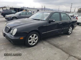 2002 Mercedes-Benz E-Class with VIN WDBJF65J42B486633, listed as a Copart auction lot 76979054 with 151,429 mi miles and Salvage Title. Bid and sale history available at carsss.com. Image 1.