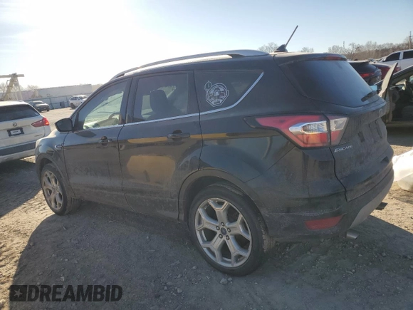 2018 Ford Escape Titanium with VIN 1FMCU9J95JUA36324, listed as a Copart auction lot 47131825 with 63,563 mi miles and Salvage title. Bid and sale history available at DreamBid. Image 2.