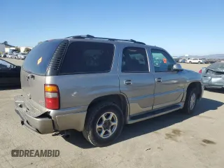 2003 GMC Yukon Denali z VIN 1GKEK63U93J339277, wystawiony jako Copart lot #42454275 z przebiegiem Nie podano mil oraz Szkody całkowita. Historia ofert i sprzedaży dostępna na DreamBid. Obrazek 3.