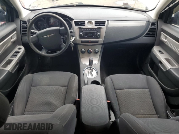 2010 Chrysler Sebring Touring z VIN 1C3CC4FB3AN203543, wystawiony jako Copart lot #57767985 z przebiegiem 152 951 mil mil oraz Szkoda całkowita • Salvage title. Historia ofert i sprzedaży dostępna na DreamBid. Obrazek 8.