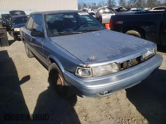 1991 Toyota Camry DLX z VIN 4T1SV21E2MU451022, wystawiony jako Copart lot #45333385 z przebiegiem 229 058 mil mil oraz Szkoda całkowita • Salvage title. Historia ofert i sprzedaży dostępna na DreamBid. Obrazek 11.