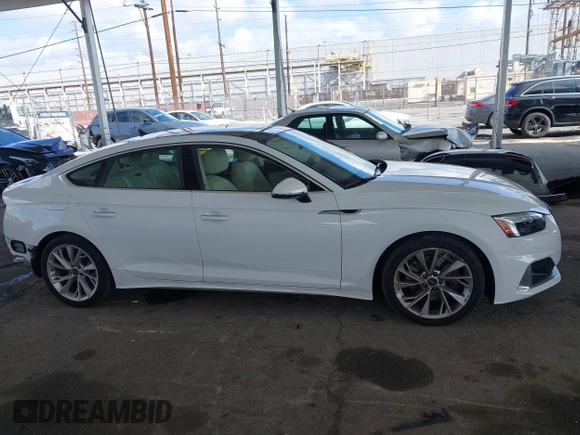 2023 Audi A5 Sportback Premium z VIN WAUABCF54PA052249, wystawiony jako IAAI lot #41916508 z przebiegiem 19 062 mil mil oraz . Historia ofert i sprzedaży dostępna na DreamBid. Obrazek 13.