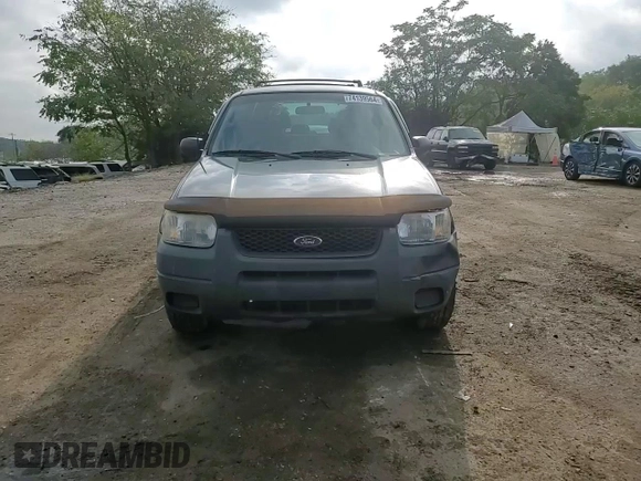 2004 Ford Escape XLS with VIN 1FMYU92104KA21454, listed as a Copart auction lot 74139564 with 217,731 mi miles and Salvage Title. Bid and sale history available at DreamBid. Image 12.