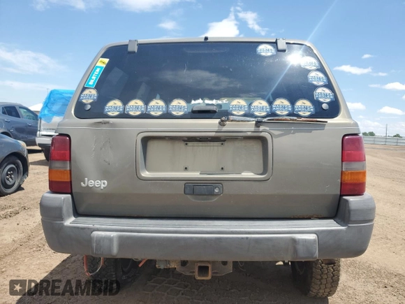 1997 Jeep Grand Cherokee Laredo z VIN 1J4GZ58S6VC636803, wystawiony jako Copart lot #59977115 z przebiegiem Nie podano mil oraz Szkoda całkowita • Salvage title. Historia ofert i sprzedaży dostępna na DreamBid. Obrazek 6.