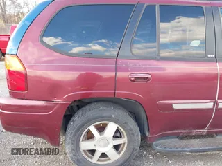 2004 GMC Envoy SLE with VIN 1GKDS13S342287315, listed as a IAAI auction lot 41486715 with 186,129 mi miles. Bid and sale history available at carsss.com. Image 14.