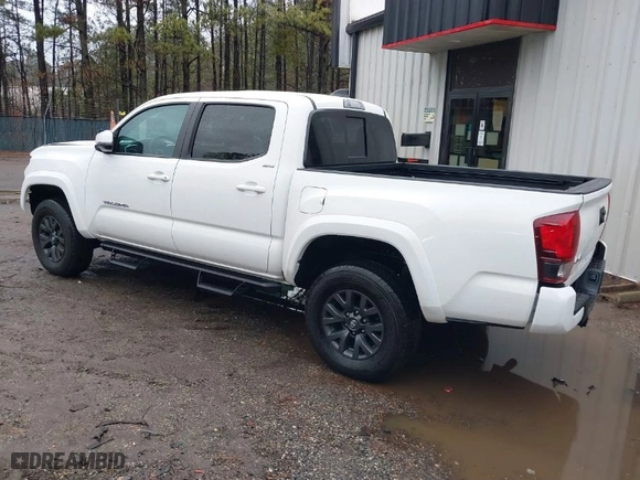 2023 Toyota Tacoma 4WD SR with VIN 3TMCZ5AN6PM633698, listed as a IAAI auction lot 41443892 with 13,214 mi miles. Bid and sale history available at carsss.com. Image 3.