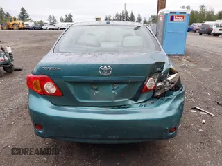 2010 Toyota Corolla with VIN 1NXBU4EE3AZ165944, listed as a IAAI auction lot 42597459 with 211,824 mi miles and . Bid and sale history available at DreamBid. Image 6.