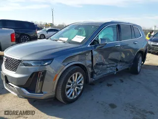 2020 Cadillac XT6 FWD Premium Luxury with VIN 1GYKPCRS8LZ129799, listed as a IAAI auction lot 41602536 with 96,865 mi miles. Bid and sale history available at carsss.com. Image 2.