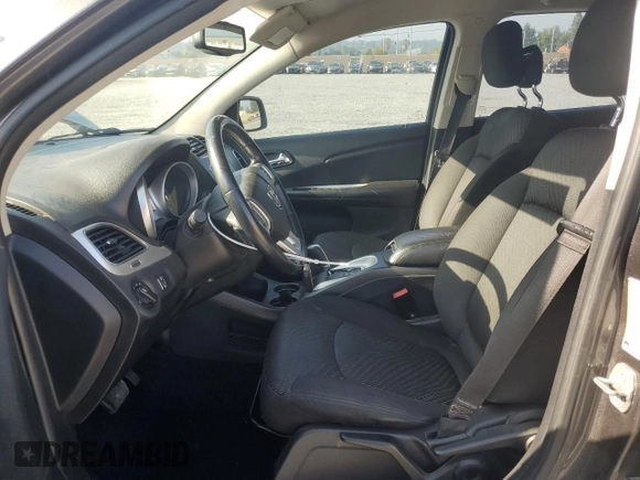 2014 Dodge Journey American Value with VIN 3C4PDCABXET277897, listed as a Copart auction lot 60566735 with 113,343 mi miles and Salvage title. Bid and sale history available at DreamBid. Image 7.