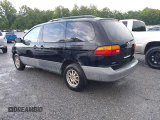 1998 Toyota Sienna LE with VIN 4T3ZF13C6WU016001, listed as a IAAI auction lot 42604162 with 214,491 mi miles and . Bid and sale history available at DreamBid. Image 3.