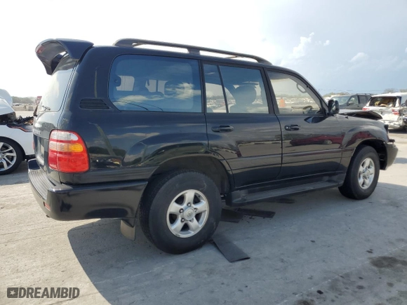 1999 Toyota Land Cruiser with VIN JT3HT05J8X0060988, listed as a Copart auction lot 52764175 with 217,199 mi miles and Salvage Title. Bid and sale history available at carsss.com. Image 3.