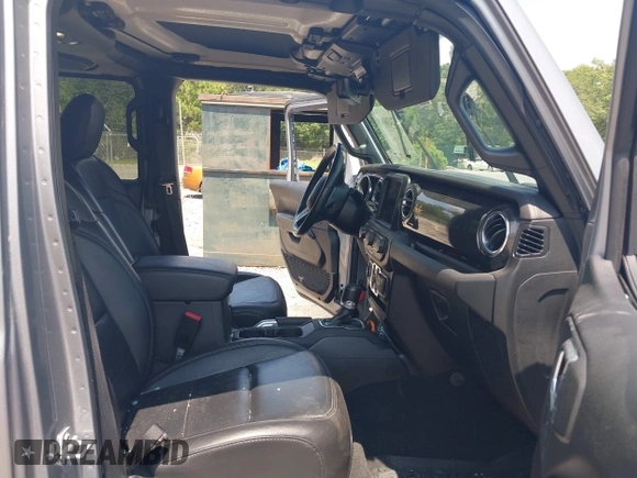 2021 Jeep Wrangler Unlimited Sahara with VIN 1C4HJXEN3MW628845, listed as a IAAI auction lot 42438049 with 49,970 mi miles and . Bid and sale history available at DreamBid. Image 5.