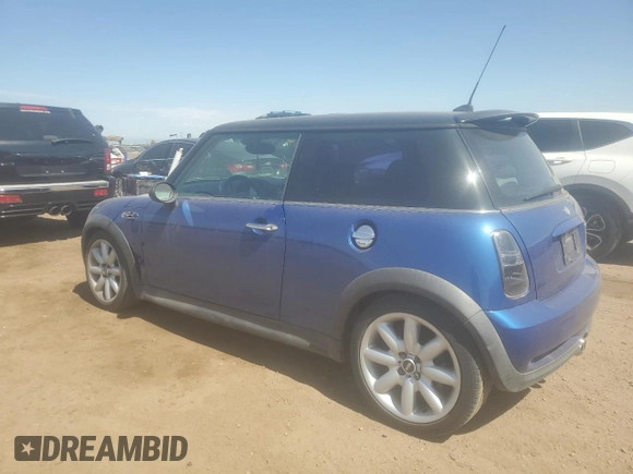 2005 MINI Hardtop S with VIN WMWRE33415TD90833, listed as a Copart auction lot 61238165 with 174,647 mi miles and Salvage title. Bid and sale history available at DreamBid. Image 2.