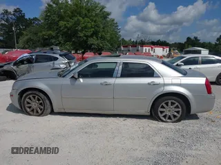 2006 Chrysler 300 Touring z VIN 2C3KA53G86H109231, wystawiony jako IAAI lot #42299031 z przebiegiem Nie podano mil oraz . Historia ofert i sprzedaży dostępna na DreamBid. Obrazek 13.