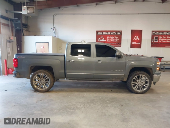 2015 Chevrolet Silverado 1500 LTZ with VIN 3GCUKSEC1FG473825, listed as a IAAI auction lot 41710553 with 212,959 mi miles and . Bid and sale history available at DreamBid. Image 14.