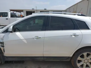 2013 Cadillac SRX Performance Collection z VIN 3GYFNDE30DS648288, wystawiony jako IAAI lot #41955462 z przebiegiem 135 956 mil mil oraz . Historia ofert i sprzedaży dostępna na DreamBid. Obrazek 14.