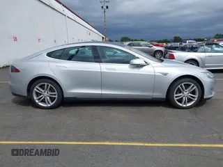 2014 Tesla Model S 60 with VIN 5YJSA1S13EFP53662, listed as a IAAI auction lot 42249930 with Not provided miles and . Bid and sale history available at DreamBid. Image 12.