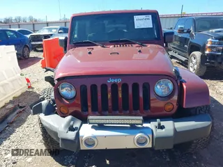 2008 Jeep Wrangler Unlimited Sahara с VIN 1J4GA59118L594851, выставлен на аукционе IAAI как лот 41643490 с пробегом 59 421 миль миль и . История ставок и продаж доступна на DreamBid. Изображение 13.