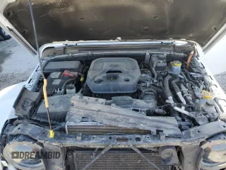 2023 Jeep Wrangler Sahara z VIN 1C4JJXP6XPW696247, wystawiony jako Copart lot #54222575 z przebiegiem 39 797 mil mil oraz Nie do naprawy • Non repairable. Historia ofert i sprzedaży dostępna na DreamBid. Obrazek 11.