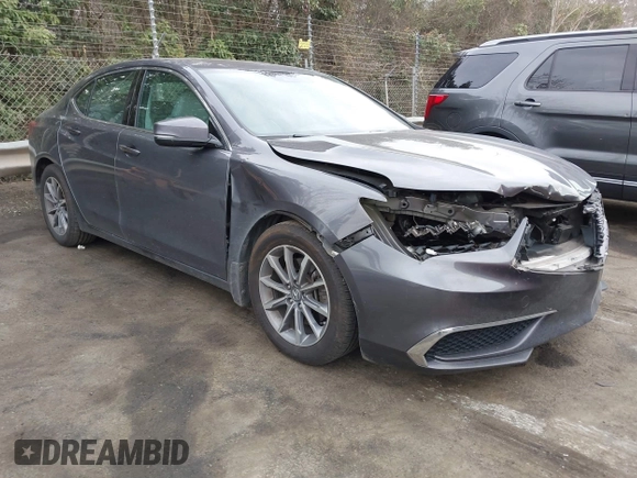 2019 Acura TLX with VIN 19UUB1F36KA004085, listed as a IAAI auction lot 41664344 with 115,125 mi miles. Bid and sale history available at carsss.com. Image 1.