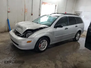 2004 Ford Focus ZTW with VIN 1FAFP35ZX4W104941, listed as a Copart auction lot 69860274 with 254,072 mi miles and Salvage title. Bid and sale history available at DreamBid. Image 1.