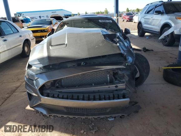 2021 Ford Mustang GT z VIN 1FA6P8CF9M5103856, wystawiony jako Copart lot #49406715 z przebiegiem 27 499 mil mil oraz Szkody całkowita. Historia ofert i sprzedaży dostępna na DreamBid. Obrazek 5.