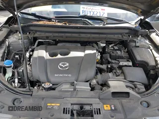 2021 Mazda CX-5 Grand Touring with VIN JM3KFADM2M1340669, listed as a IAAI auction lot 41916687 with 83,872 mi miles. Bid and sale history available at carsss.com. Image 10.