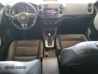 2014 Volkswagen Tiguan SEL with VIN WVGBV3AX2EW541476, listed as a Copart auction lot 64817795 with 158,032 mi miles and Salvage title. Bid and sale history available at DreamBid. Image 8.