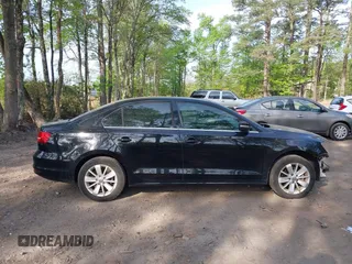 2015 Volkswagen Jetta SE z VIN 3VWD07AJ1FM277499, wystawiony jako IAAI lot #42085122 z przebiegiem 122 754 mil mil oraz . Historia ofert i sprzedaży dostępna na DreamBid. Obrazek 13.