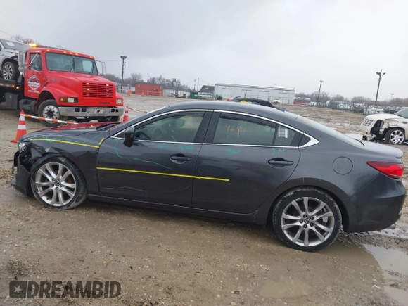 2015 Mazda 6 i Grand Touring with VIN JM1GJ1W56F1207077, listed as a IAAI auction lot 41734641 with 109,447 mi miles and . Bid and sale history available at DreamBid. Image 14.