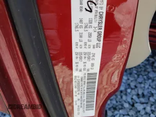 2014 Dodge Grand Caravan American Value with VIN 2C4RDGBG3ER323793, listed as a Copart auction lot 49095945 with 102,129 mi miles and Salvage Title. Bid and sale history available at DreamBid. Image 13.