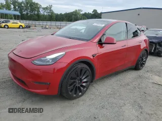 2023 Tesla Model Y Performance z VIN 7SAYGDEF2PF857843, wystawiony jako Copart lot #57324255 z przebiegiem 22 618 mil mil oraz Szkoda całkowita • Salvage title. Historia ofert i sprzedaży dostępna na DreamBid. Obrazek 1.