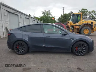2022 Tesla Model Y Performance z VIN 7SAYGDEF5NF544542, wystawiony jako IAAI lot #42118855 z przebiegiem 27 256 mil mil oraz . Historia ofert i sprzedaży dostępna na DreamBid. Obrazek 13.