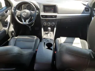 2016 Mazda CX-5 Touring with VIN JM3KE2CY0G0894283, listed as a Copart auction lot 50592065 with 86,400 mi miles and Salvage Title. Bid and sale history available at carsss.com. Image 8.