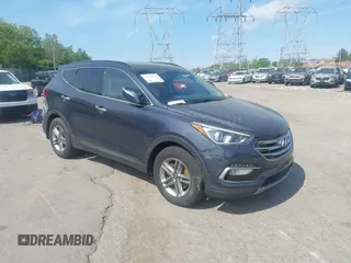 2018 Hyundai Santa Fe 2.4L z VIN 5XYZUDLB9JG522363, wystawiony jako IAAI lot #42138661 z przebiegiem 138 316 mil mil oraz . Historia ofert i sprzedaży dostępna na DreamBid. Obrazek 1.