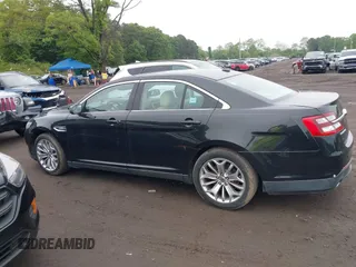 2014 Ford Taurus Limited z VIN 1FAHP2J8XEG112310, wystawiony jako IAAI lot #42367397 z przebiegiem 77 329 mil mil oraz . Historia ofert i sprzedaży dostępna na DreamBid. Obrazek 14.