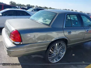 2002 Ford Crown Victoria Police Pkg Police Interceptor with VIN 2FAFP71W52X143053, listed as a IAAI auction lot 41594827 with 210,078 mi miles. Bid and sale history available at carsss.com. Image 6.