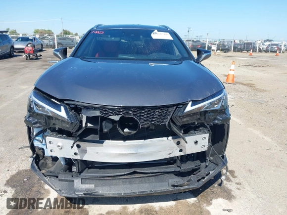2021 Lexus UX 250h F Sport z VIN JTHR9JBH3M2052706, wystawiony jako IAAI lot #42321784 z przebiegiem 23 290 mil mil oraz . Historia ofert i sprzedaży dostępna na DreamBid. Obrazek 13.