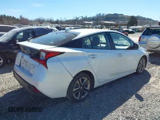 2021 Toyota Prius L Eco z VIN JTDKAMFUXM3142402, wystawiony jako IAAI lot #41665484 z przebiegiem 67 416 mil mil oraz . Historia ofert i sprzedaży dostępna na DreamBid. Obrazek 4.