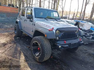2015 Jeep Wrangler Unlimited Rubicon Hard Rock with VIN 1C4HJWFG1FL777222, listed as a IAAI auction lot 41843893 with 74,718 mi miles. Bid and sale history available at carsss.com. Image 1.