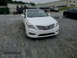 2014 Hyundai Azera Limited z VIN KMHFH4JG1EA388388, wystawiony jako Copart lot #58166675 z przebiegiem Nie podano mil oraz Szkoda całkowita • Salvage title. Historia ofert i sprzedaży dostępna na DreamBid. Obrazek 14.