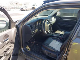 2010 Dodge Charger SXT with VIN 2B3CA3CV6AH185978, listed as a IAAI auction lot 41661822 with 166,601 mi miles. Bid and sale history available at carsss.com. Image 5.