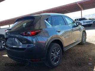 2021 Mazda CX-5 Touring with VIN JM3KFACM2M1313750, listed as a IAAI auction lot 41762938 with 68,503 mi miles. Bid and sale history available at carsss.com. Image 4.